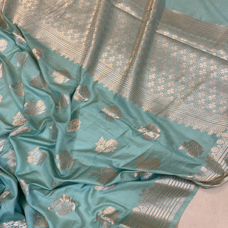 Elevate your style with our serene sea blue handloom Banarasi silk saree. Perfect for special occasions, exuding timeless elegance. Shop now!
