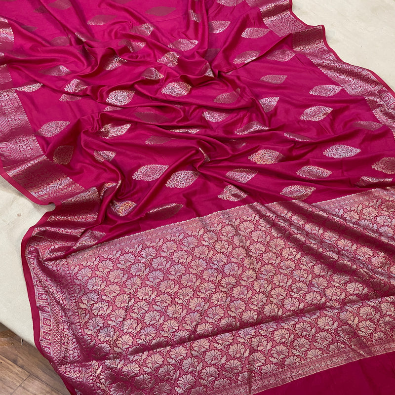 Stand out at weddings and festivals with our bold hot pink handloom Banarasi silk sari. Make a statement with this versatile piece of traditional craftsmanship.