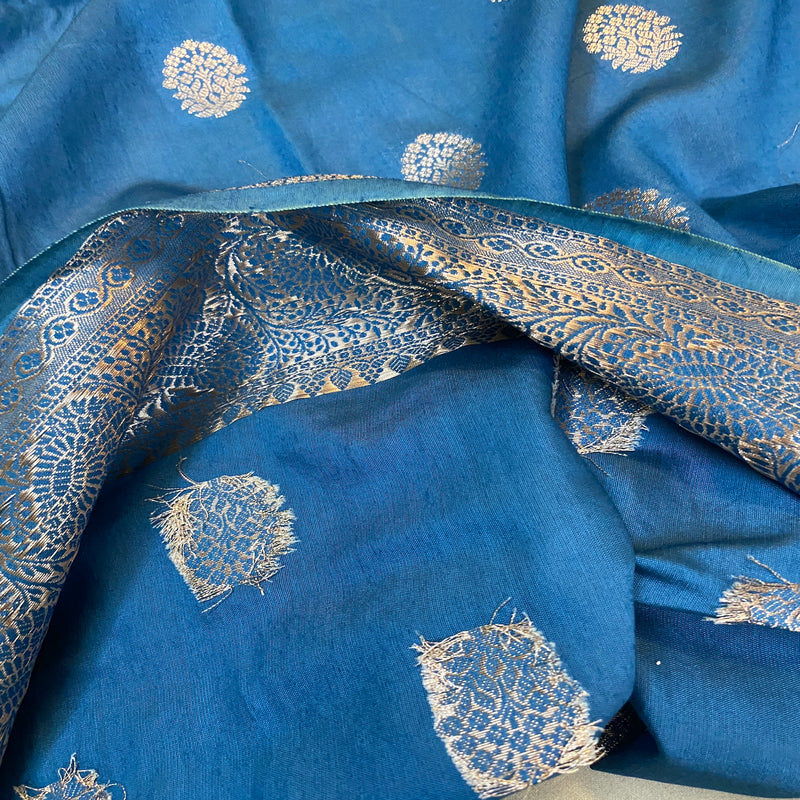 Embrace elegance with our classic blue handloom crepe Banarasi silk sari. Perfect for formal occasions and cultural celebrations!