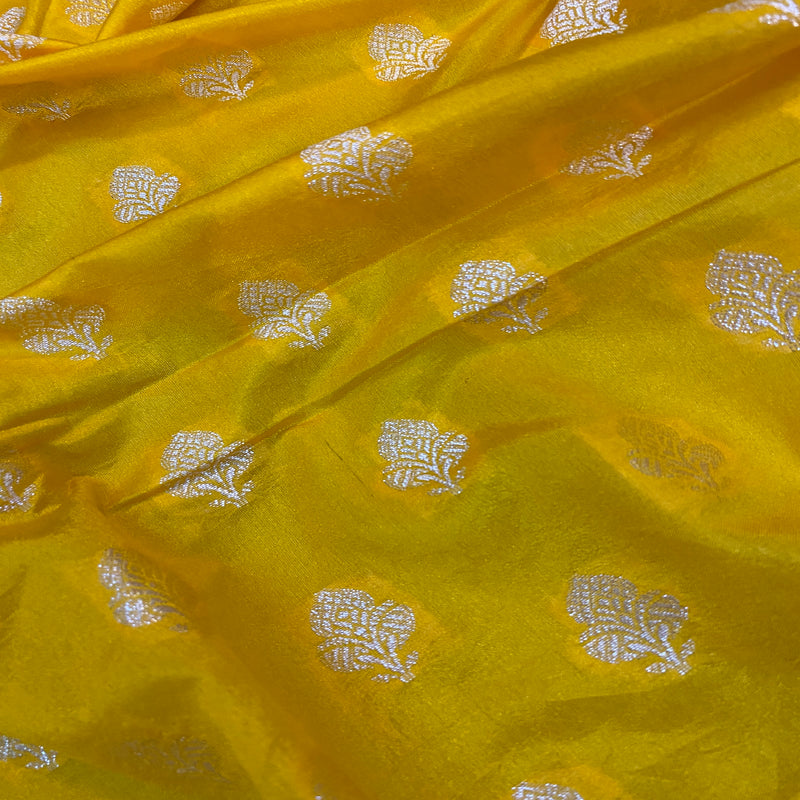 Vibrant yellow handloom crepe Banarasi silk sari, ideal for traditional ceremonies and cultural events. Elevate your festive look with this versatile piece!