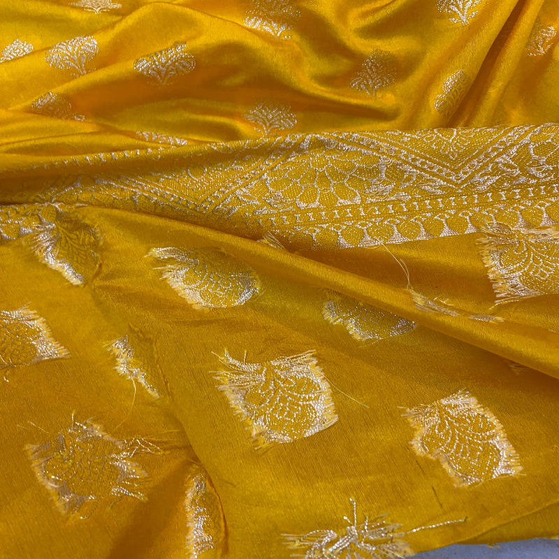 Festive yellow handloom crepe Banarasi silk sari, perfect for traditional ceremonies and cultural events. Elevate your look with this elegant piece!