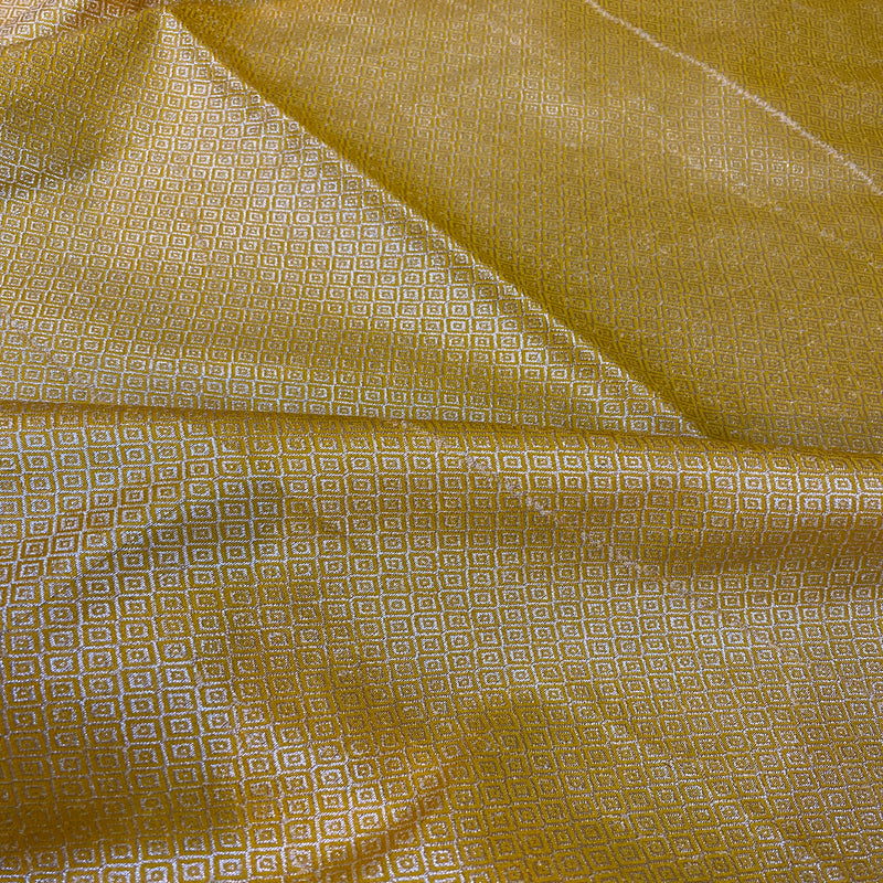 Vibrant yellow handloom crepe Banarasi silk sari, ideal for celebrating in style at traditional ceremonies and cultural events. Shop now!