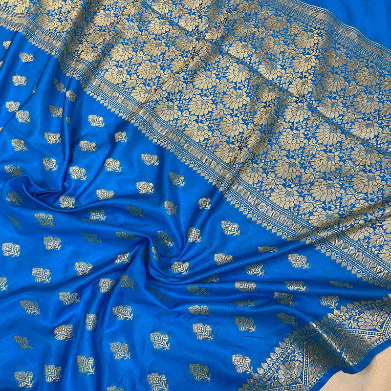 Elevate your style with our sophisticated blue handloom crepe Banarasi silk sari. Perfect for formal events and festivities, exuding artisanal elegance.