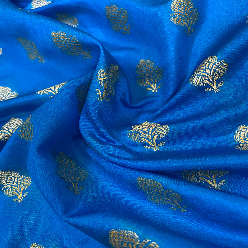 Blue handloom crepe Banarasi silk sari: ideal for formal events and festivities, showcasing elegance and craftsmanship. Elevate your style now!