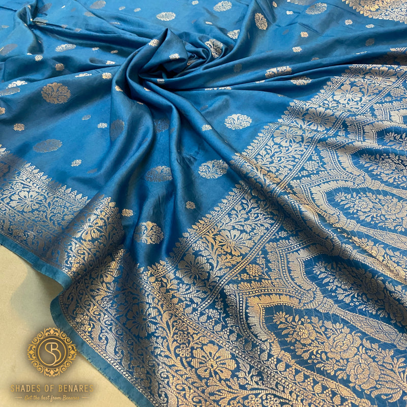 Matte blue handloom crepe Banarasi silk saree. Elevate your look with this elegant, versatile piece. Perfect for formal events and festive celebrations. Shop now!