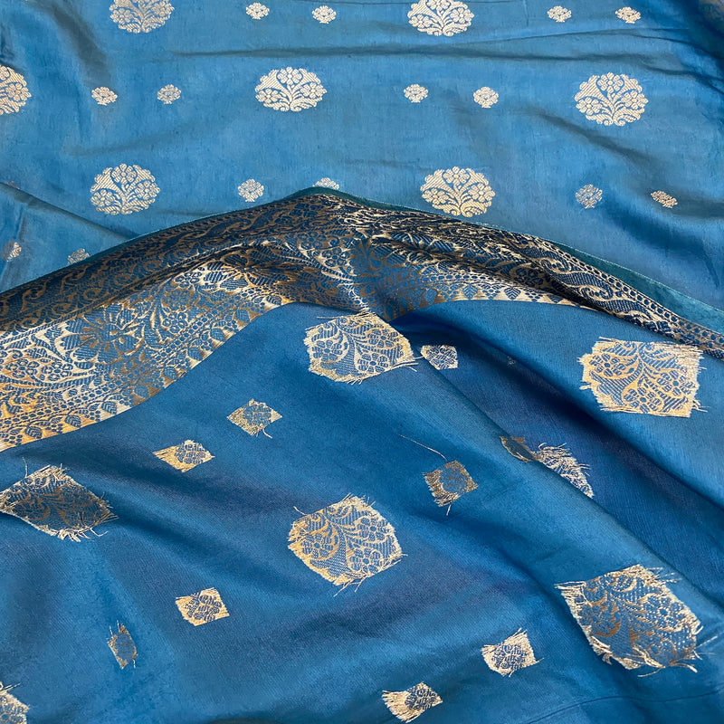 Elevate your look with a matte blue handloom crepe Banarasi silk saree ideal for formal events and festive occasions. Perfect balance of elegance and artisanal craftsmanship.