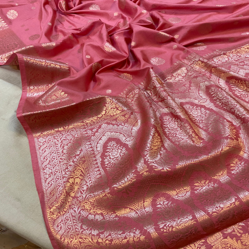 Luxurious pink handloom crepe Banarasi silk saree with intricate patterns in vibrant pink hue. Perfect for weddings, festivals, and special occasions.