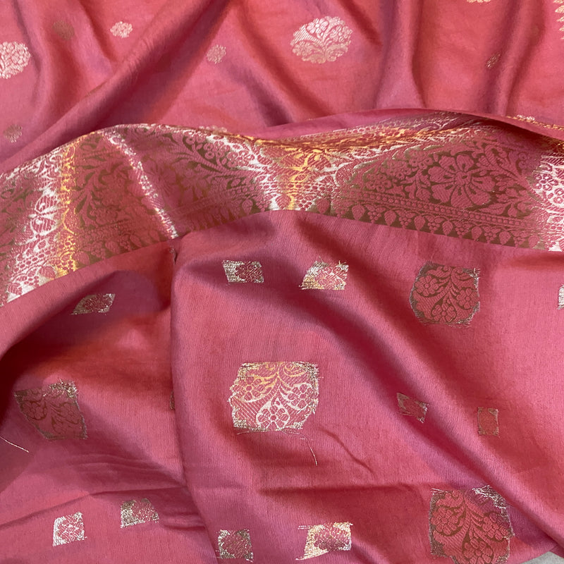 Handcrafted from 100% silk, this luxurious pink Banarasi silk saree features intricate patterns and a vibrant hue. Perfect for weddings and festivals.