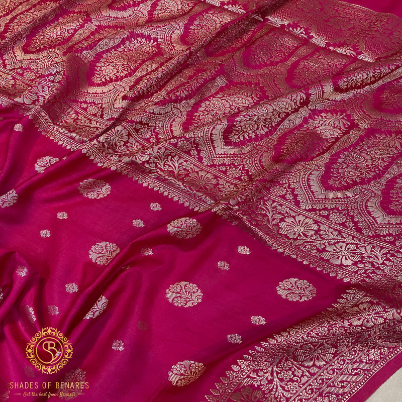 Hot pink handloom crepe Banarasi silk sari with intricate details and vibrant color. Versatile for weddings, festivals, or formal events.