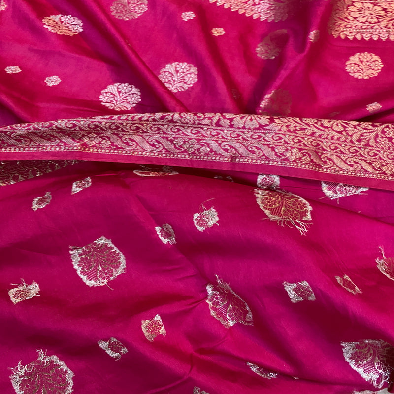 Hot pink Banarasi silk sari: bold, handcrafted with intricate details and vibrant color. Perfect for weddings, festivals, and formal events. Embrace Indian elegance.