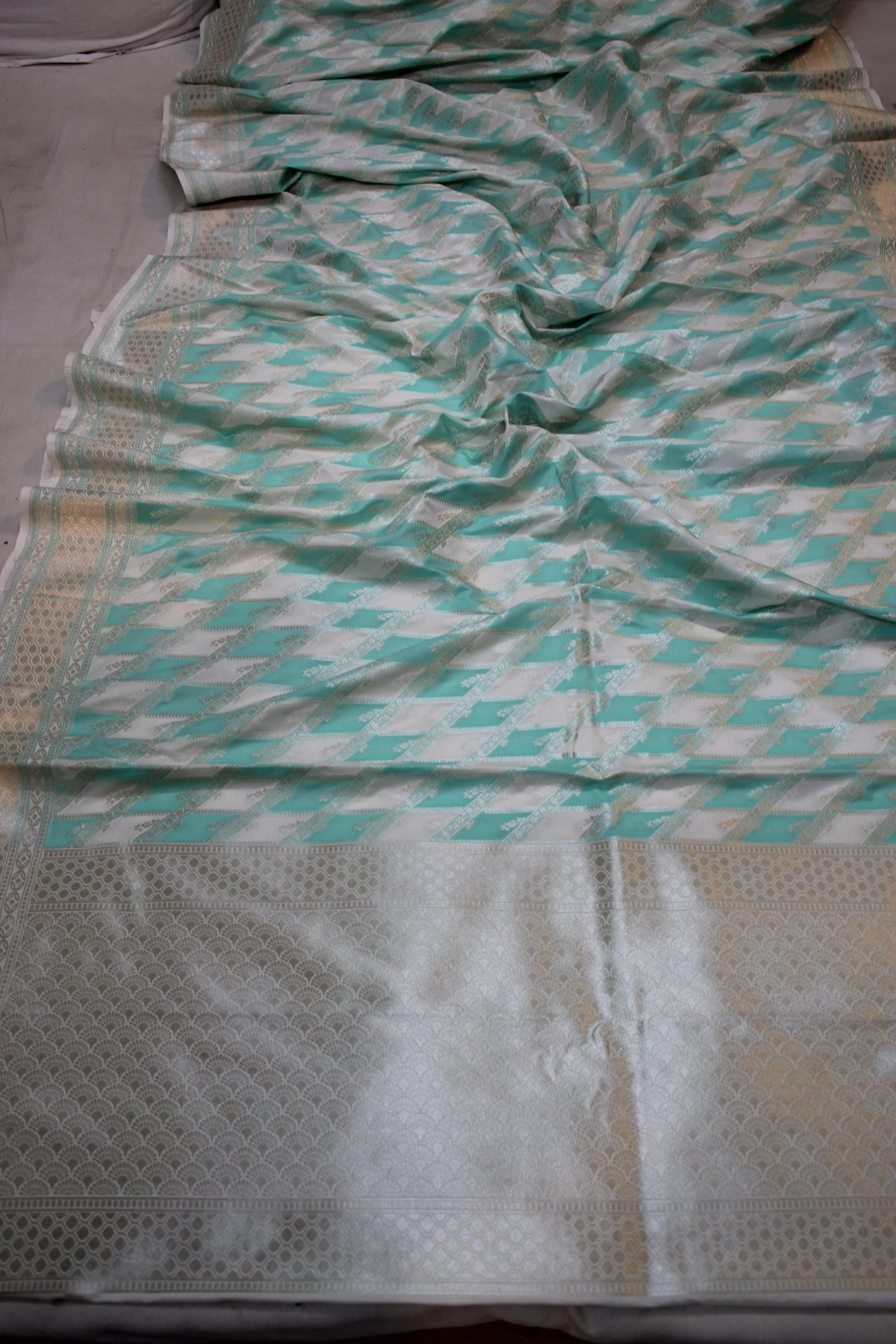 Tranquil Elegance: Sea Green and White Handloom Pure Silk Banarasi Saree by Shades Of Benares - banarasi - banarasi saree shop