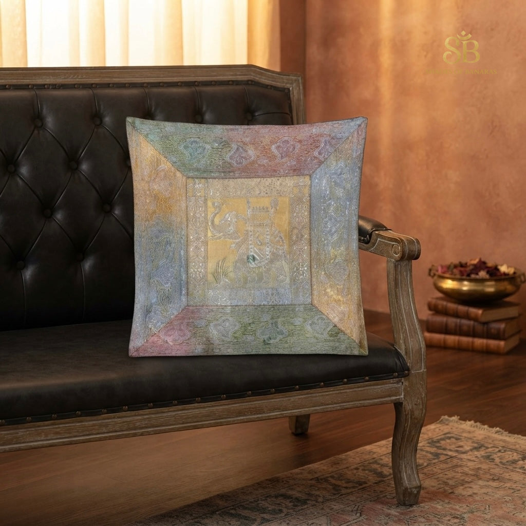 Multicolor pastel brocade Banarasi cushion cover with mitred border on a leather sofa