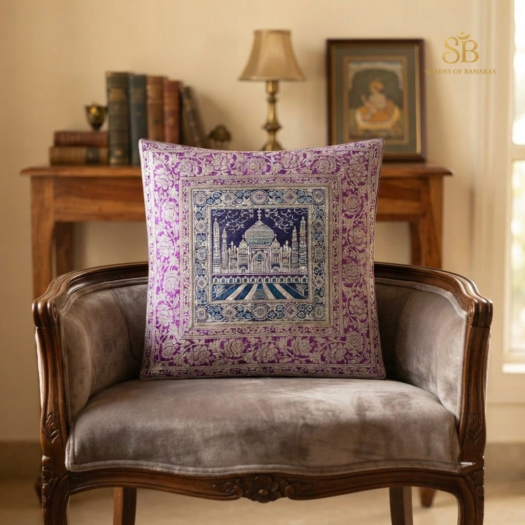 Purple brocade Banarasi cushion cover with Taj Mahal motif on a grey velvet tub chair