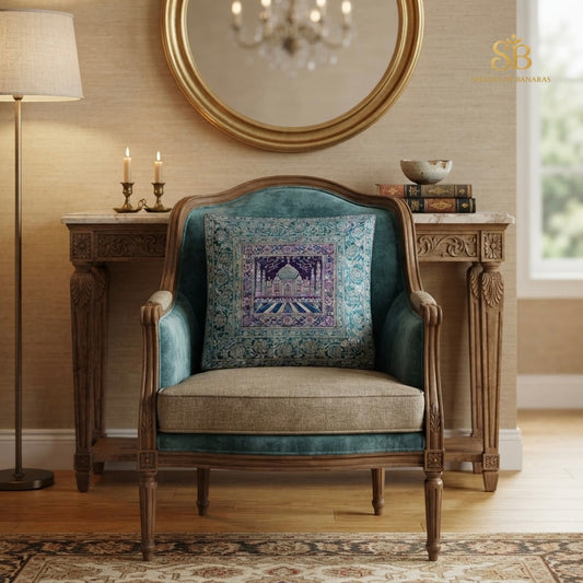 Teal blue brocade Banarasi cushion cover with Taj Mahal motif on a teal velvet chair