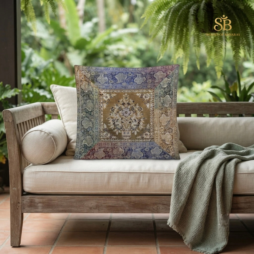 Multicolor brocade Banarasi cushion cover with floral urn motif on a teak daybed