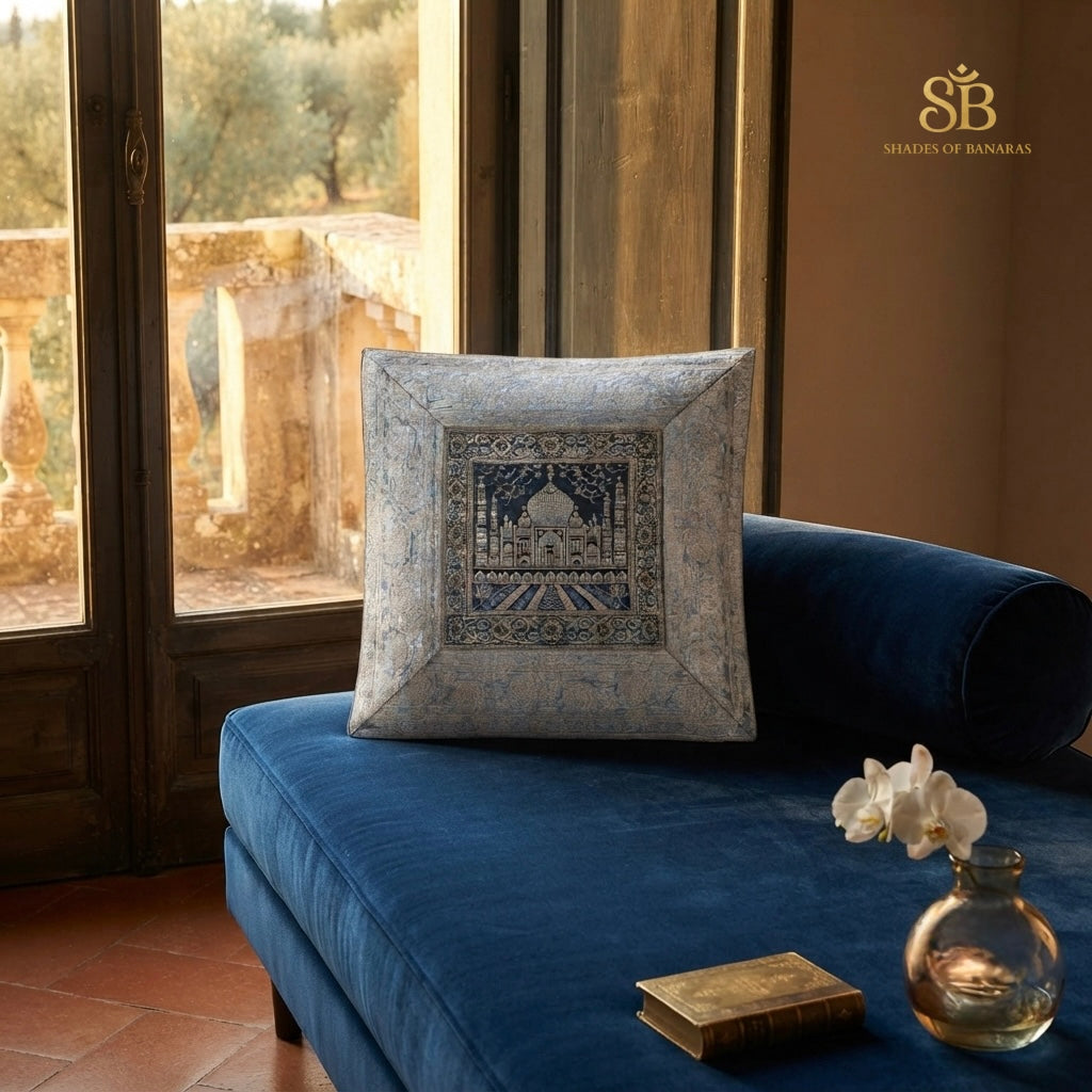 Light blue pure brocade Banarasi handloom cushion cover with Taj Mahal motif on a blue velvet chaise
