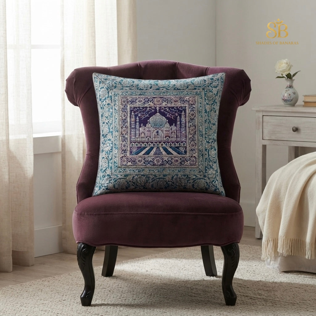 Teal blue pure brocade Banarasi handloom cushion cover with Taj Mahal motif on a plum velvet chair