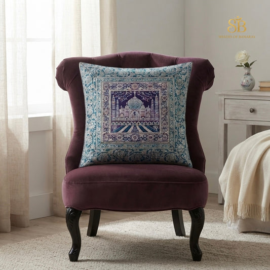 Teal blue pure brocade Banarasi handloom cushion cover with Taj Mahal motif on a plum velvet chair