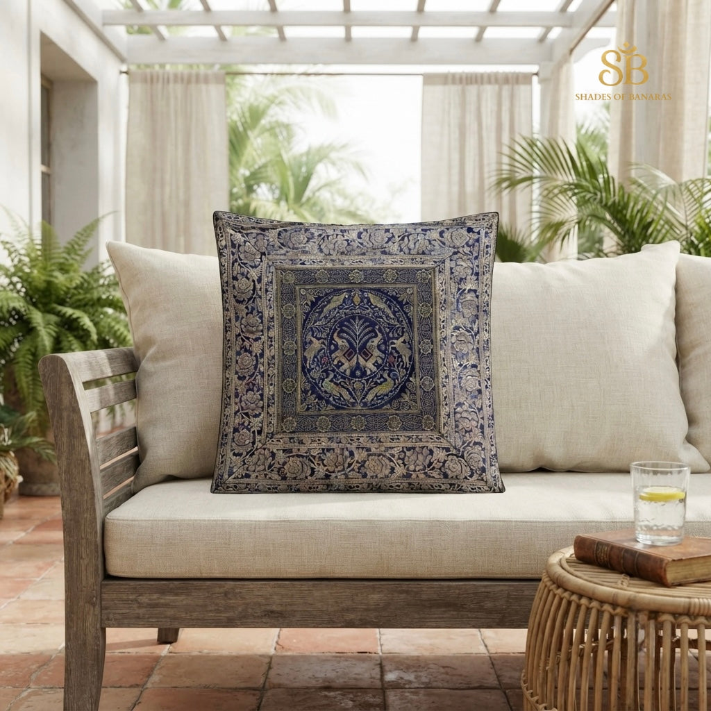 Indigo blue pure brocade Banarasi handloom cushion cover with circular medallion motif on a veranda sofa