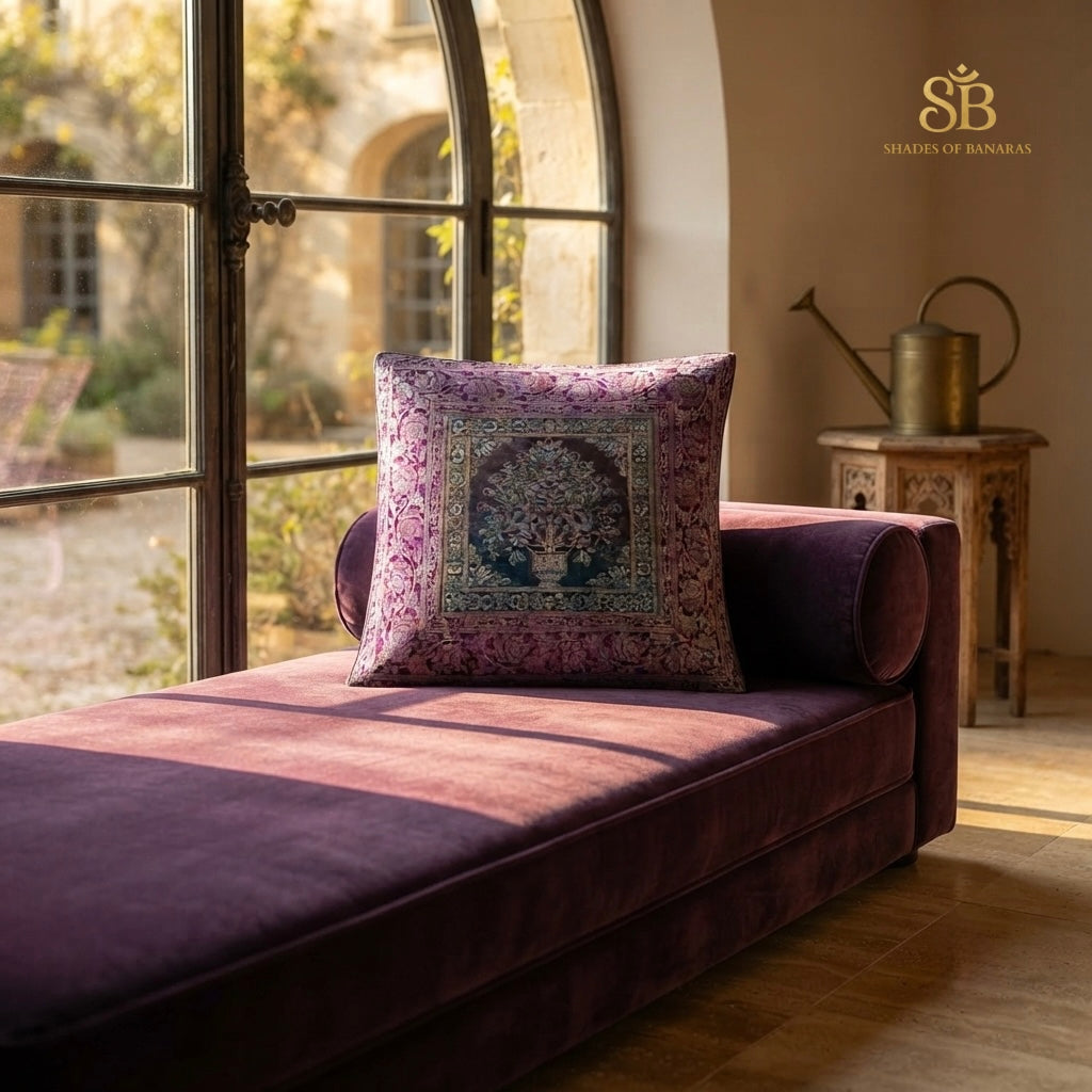 Purple pure brocade Banarasi handloom cushion cover with flowering tree motif on a plum chaise