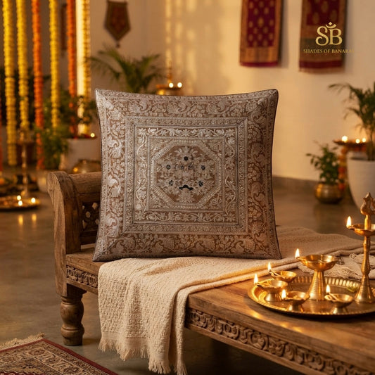 Light brown pure brocade Banarasi handloom cushion cover with octagon medallion on a carved wooden bench