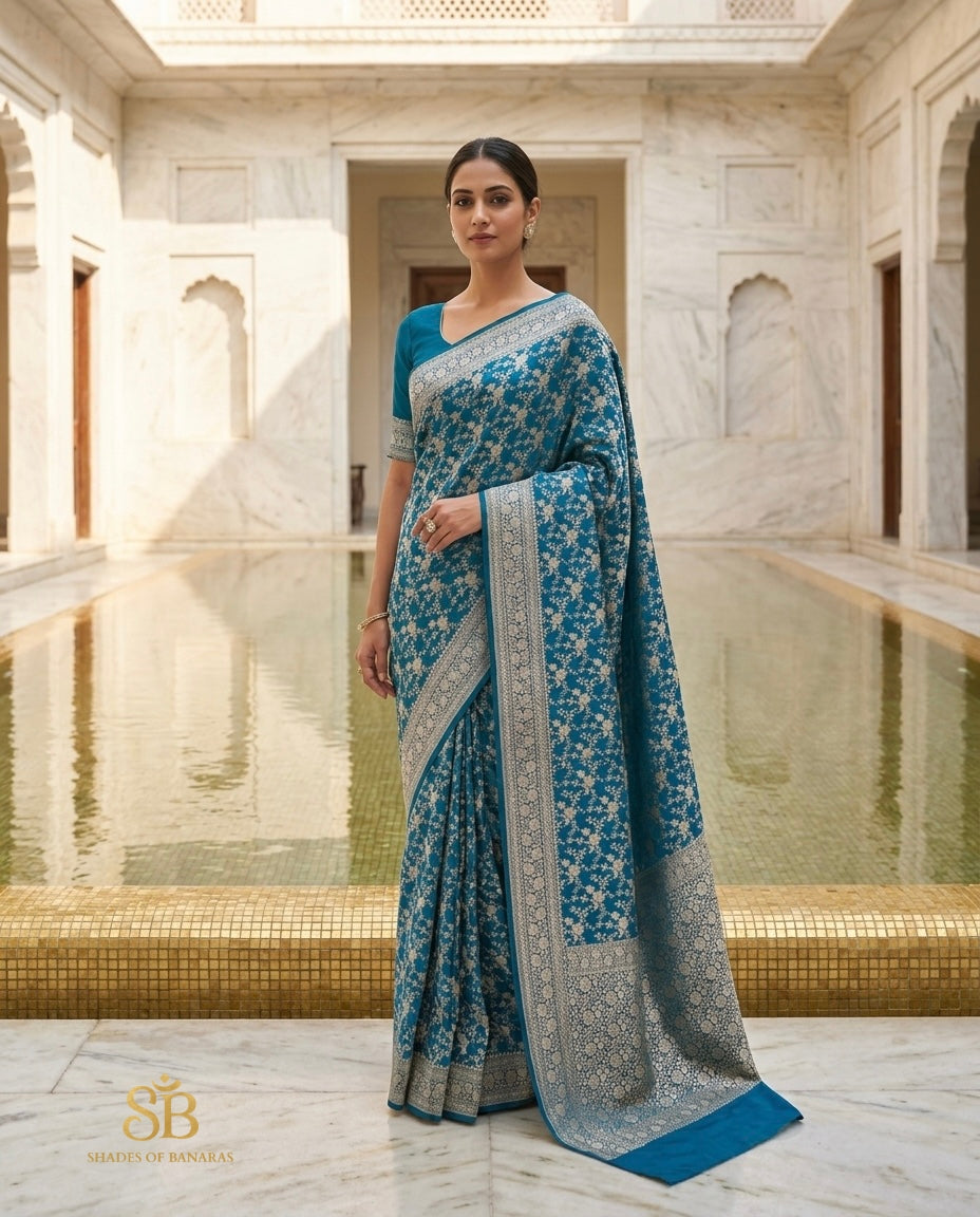 Peacock teal pure Katan silk Banarasi handloom saree with silver zari border